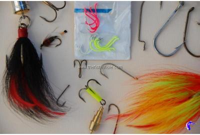 assorted fishing hooks on flat surface