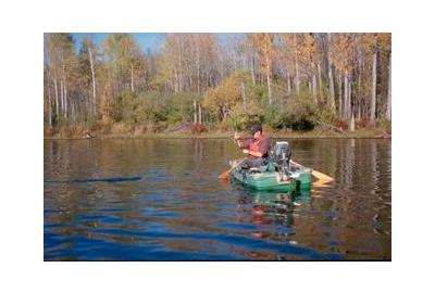 float boat in lake water autumn fall tree line