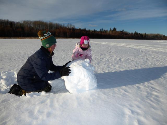 Building a snowman with Grammy.