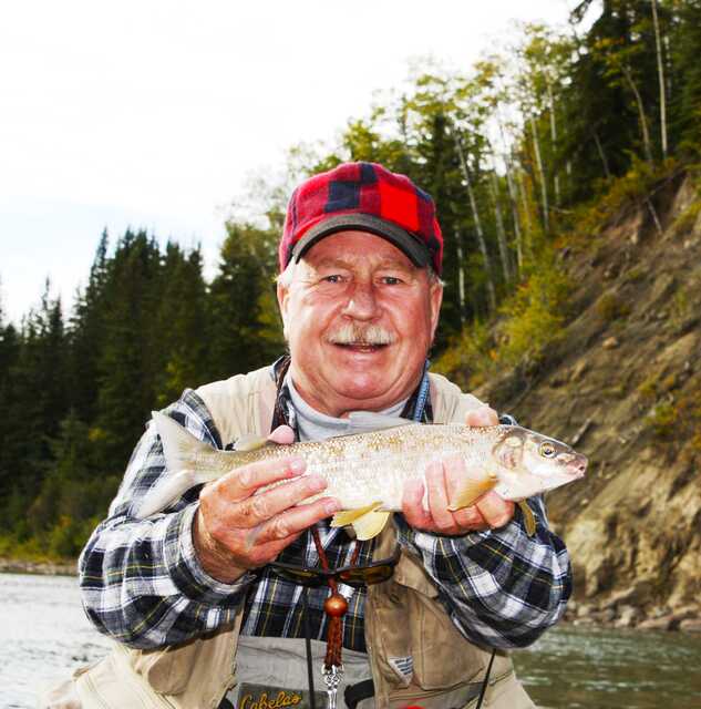 man holding a rocky fish