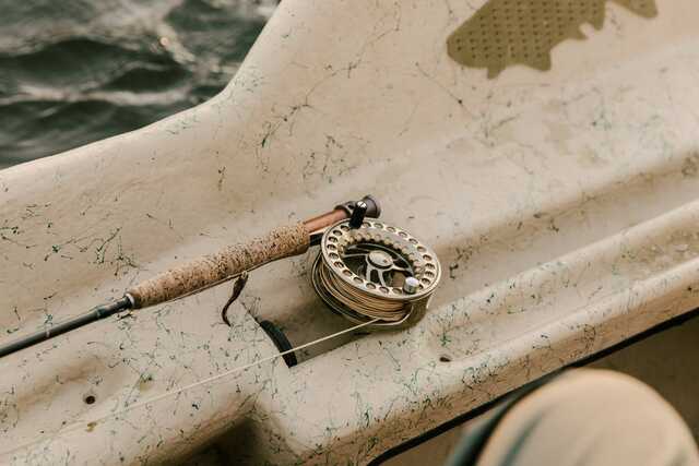 close up of fly reel attached to rod